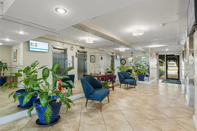 a view of a tall building with a tree