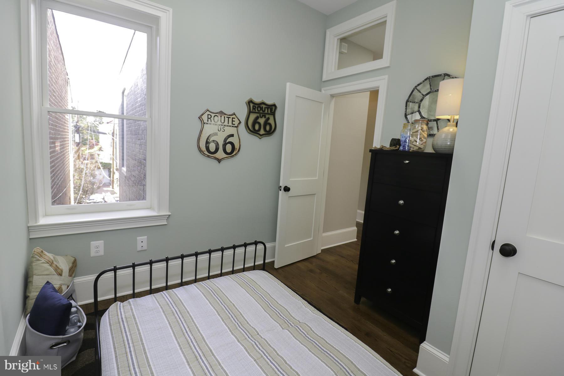 124 11th Street Northeast Washington, DC 20002 - Photo 21 of 30 a bedroom with a bed and a window