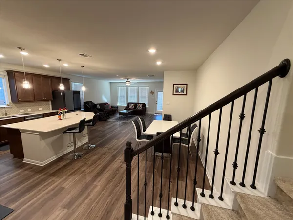 a lobby with furniture and stairs