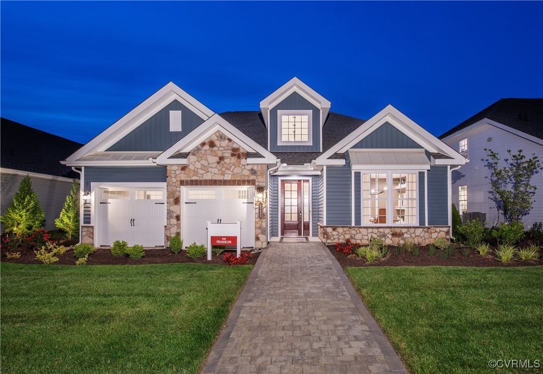 Undisclosed Address Chester, VA 23831 - Photo 1 of 30 a front view of a house with a yard and potted plants
