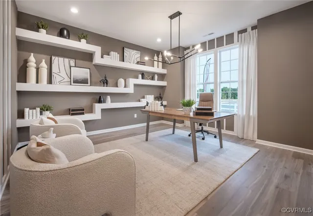 a workspace with furniture and a book shelf