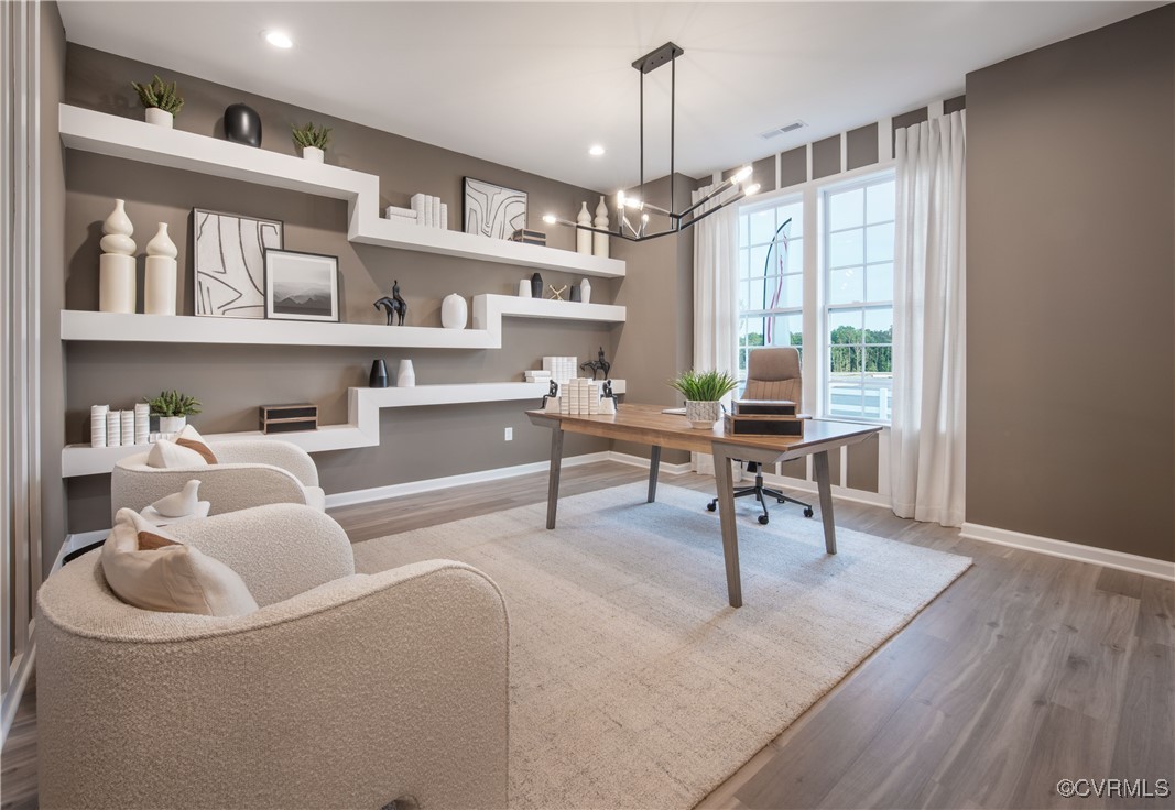 Undisclosed Address Chester, VA 23831 - Photo 12 of 30 a workspace with furniture and a book shelf