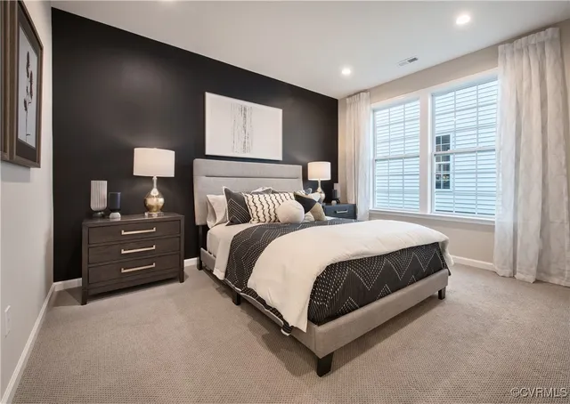 a bed room with a bed and a tv