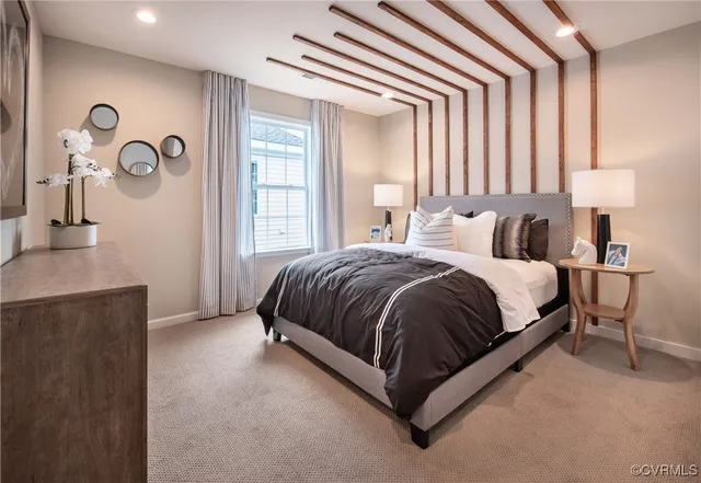 a spacious bedroom with a bed and a dresser