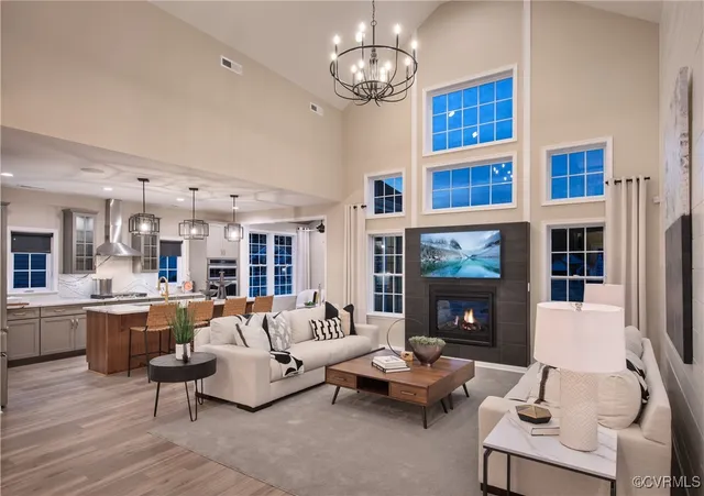 a living room with furniture fireplace and flat screen tv