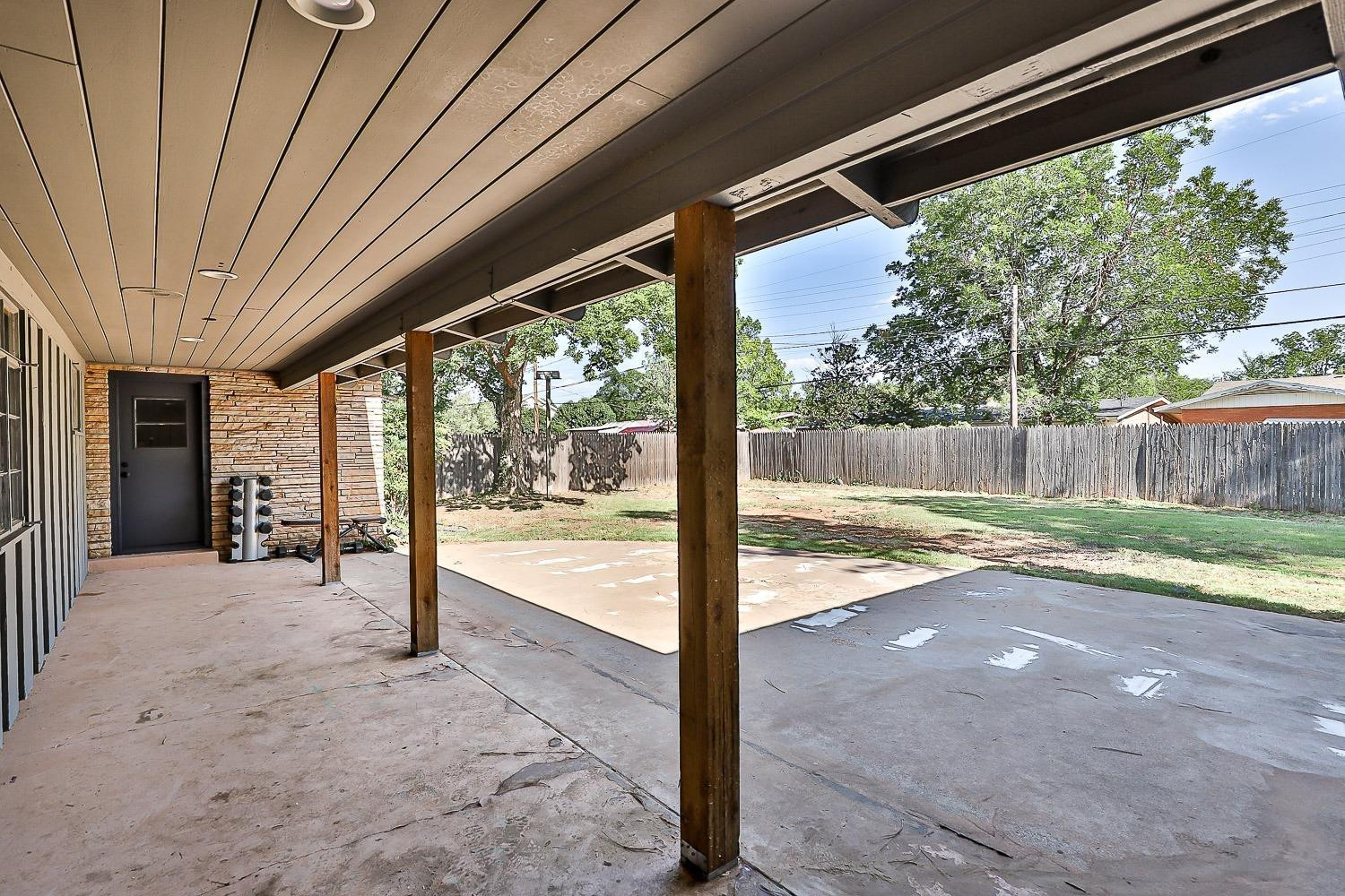 3411 42nd Street Lubbock, TX 79413 - Photo 12 of 33 a view of a porch with a backyard
