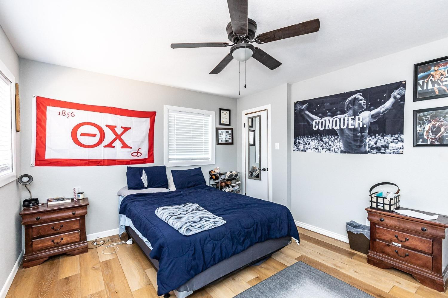 3411 42nd Street Lubbock, TX 79413 - Photo 13 of 33 a living room with furniture and a flat screen tv