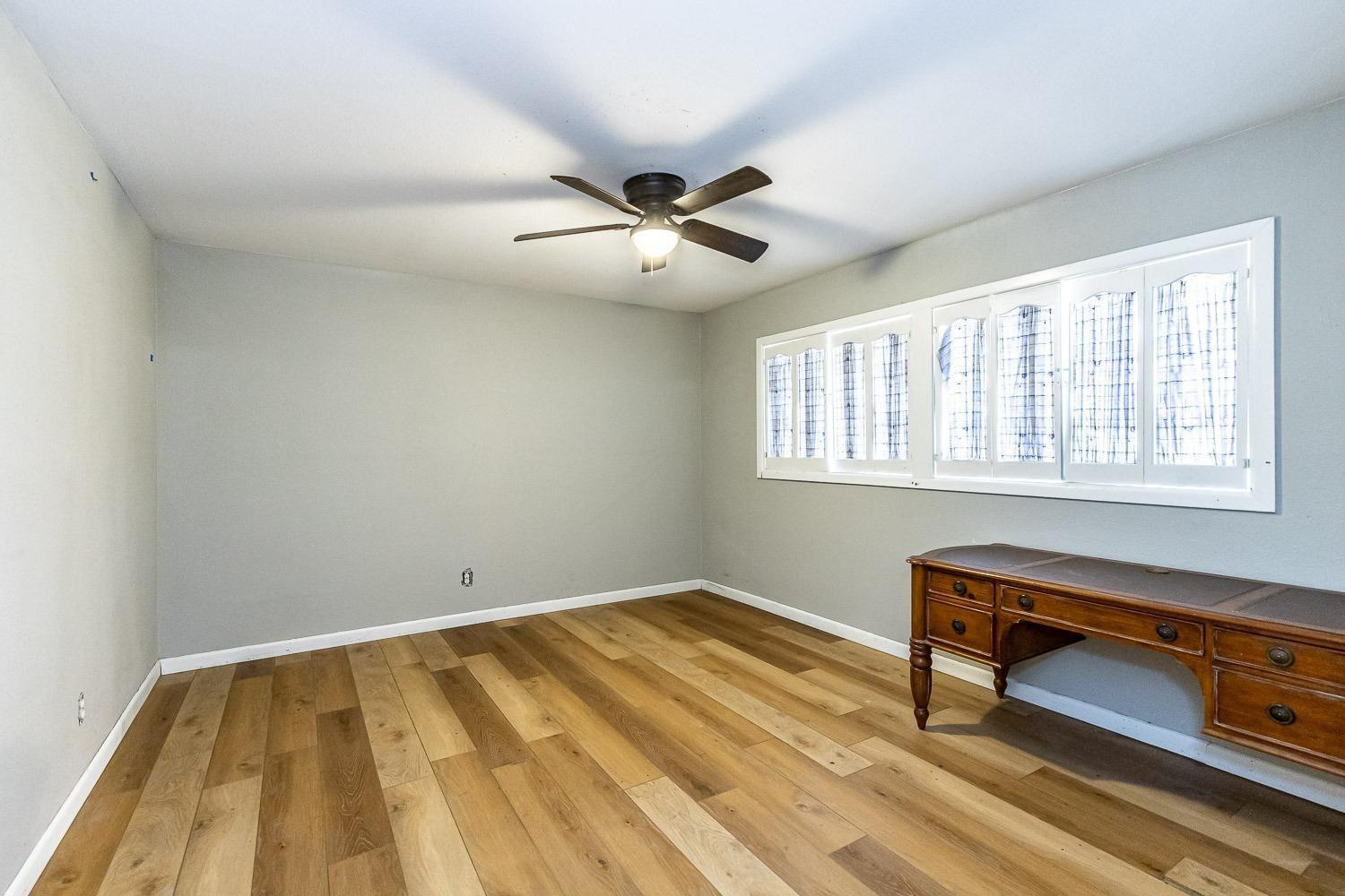 3411 42nd Street Lubbock, TX 79413 - Photo 24 of 33 a bedroom with a bed and a window