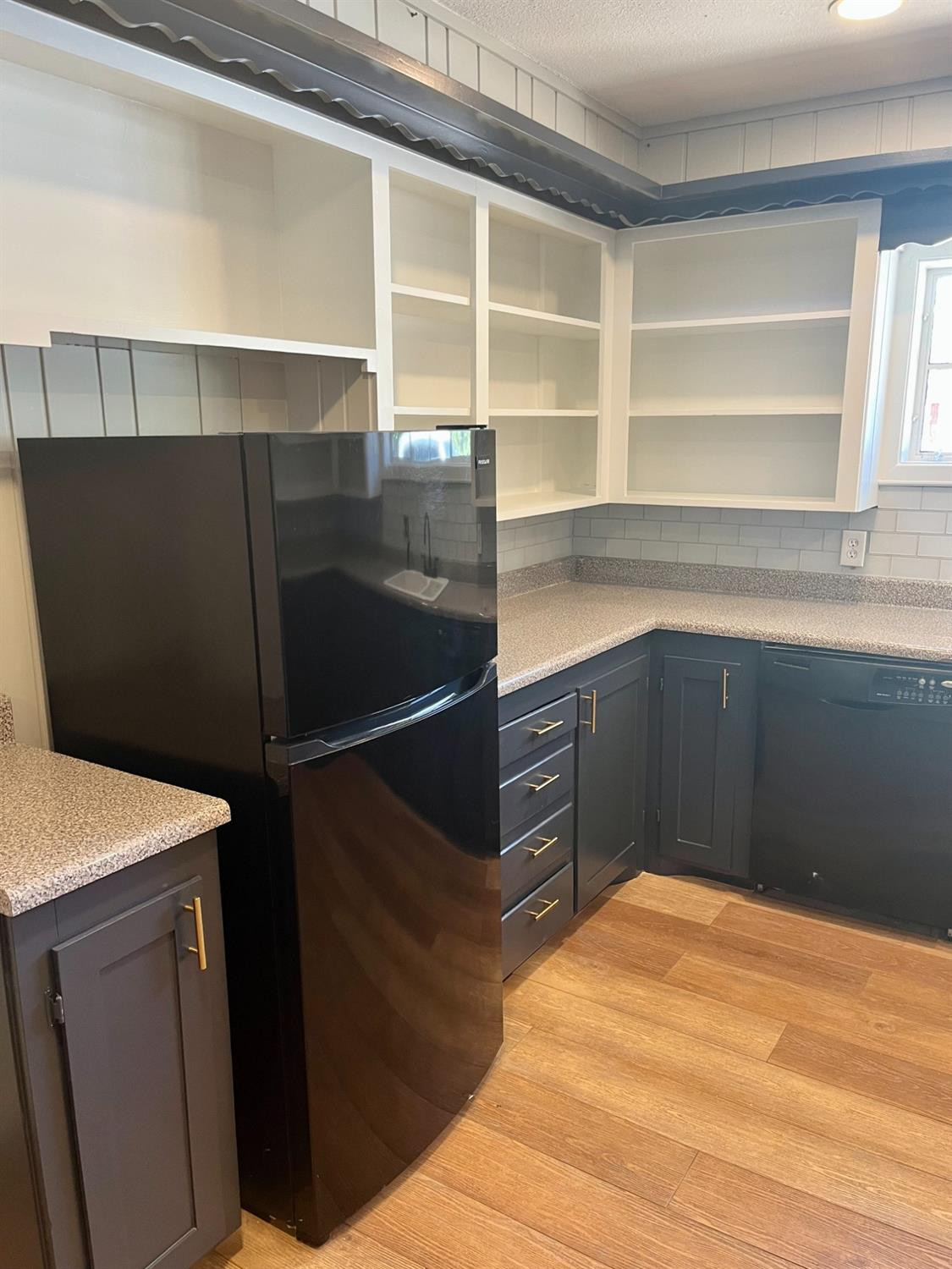 3411 42nd Street Lubbock, TX 79413 - Photo 5 of 33 a bathroom with a sink and a mirror