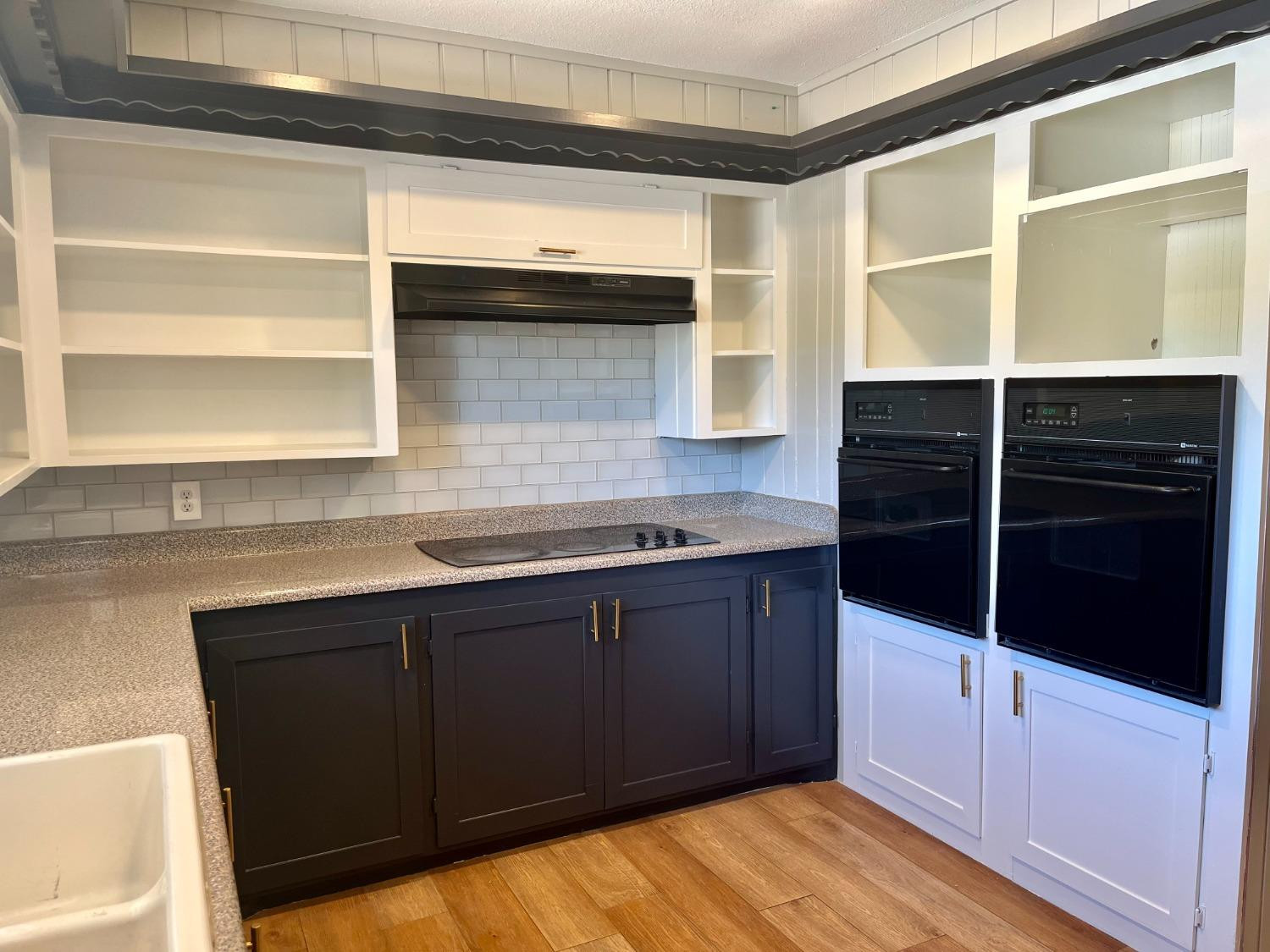 3411 42nd Street Lubbock, TX 79413 - Photo 8 of 33 a kitchen with a cabinets and a sink