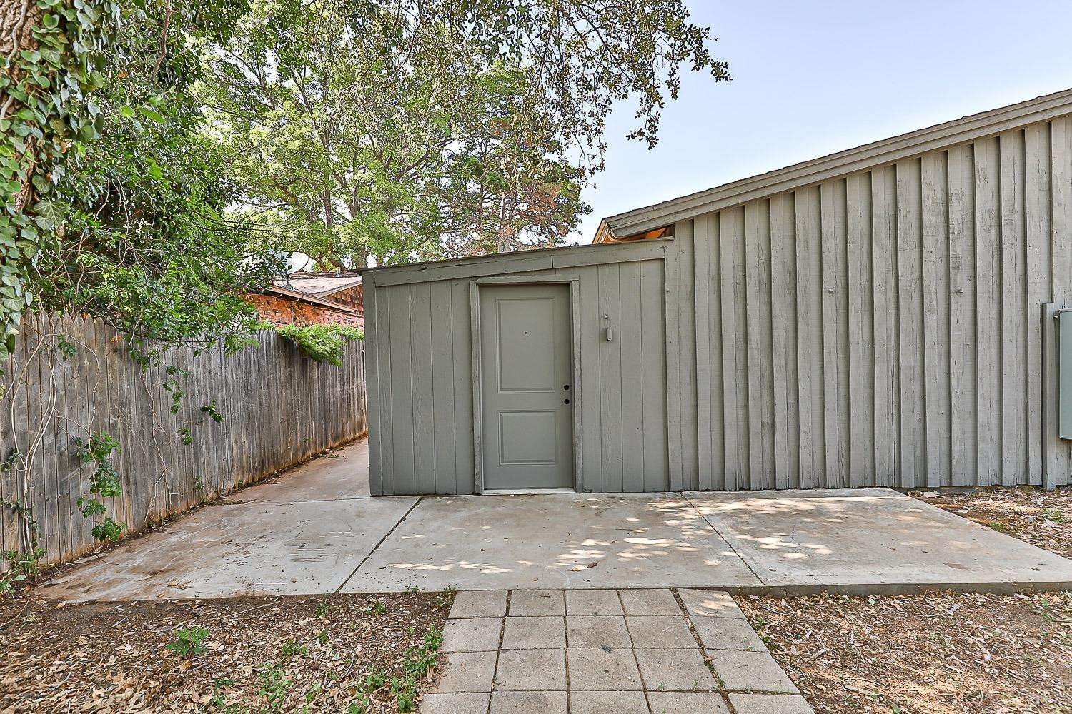 3411 42nd Street Lubbock, TX 79413 - Photo 9 of 33 a view of a house with a backyard