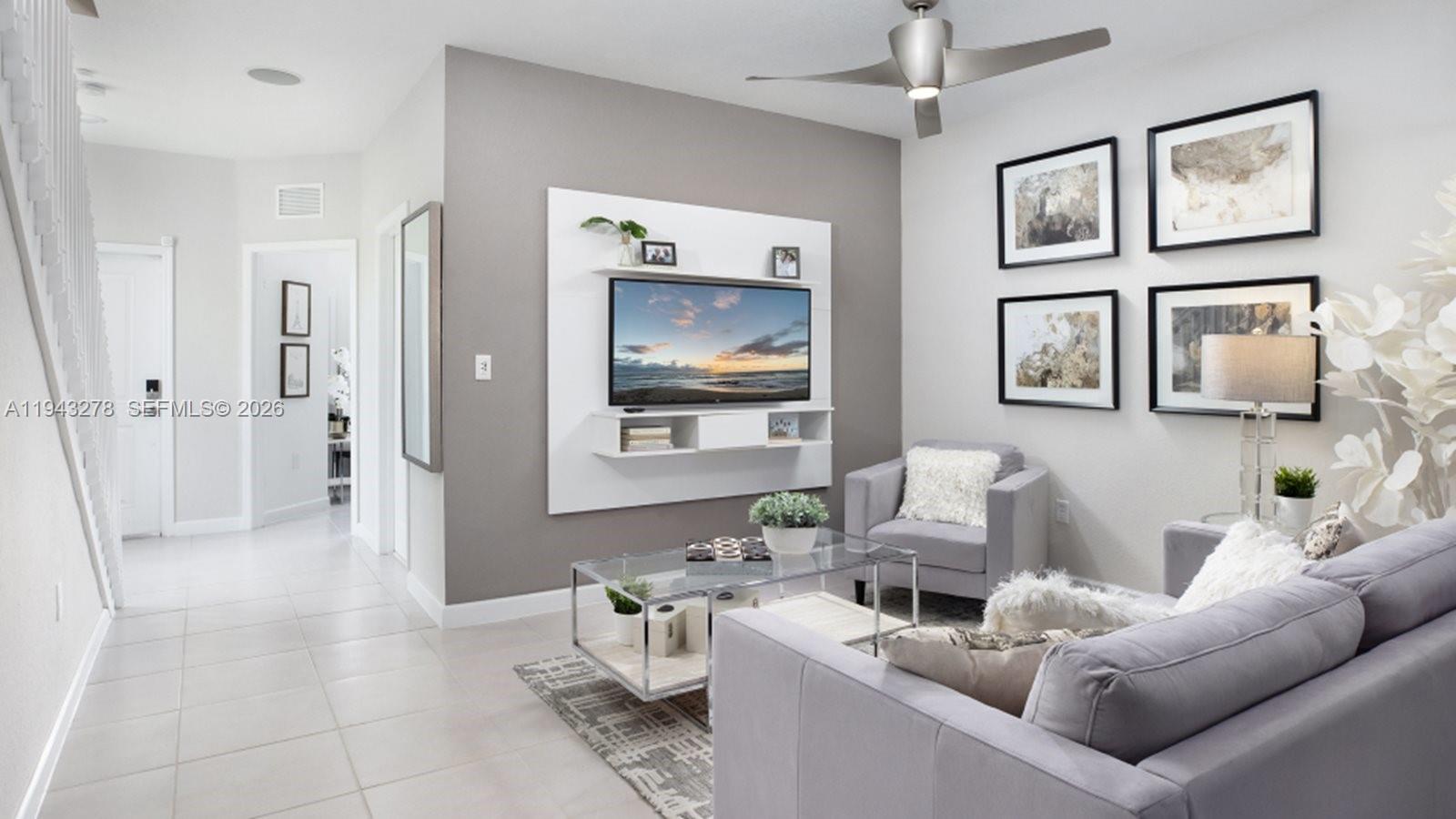 2663 Southeast 27th Street Homestead, FL 33035 - Photo 4 of 8 a living room with furniture and a flat screen tv