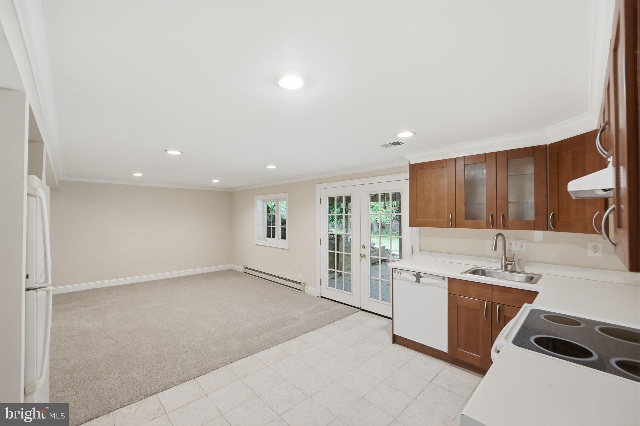 14204 Piccadilly Road Silver Spring, MD 20906 - Photo 26 of 42 Opens to custom patio under deck