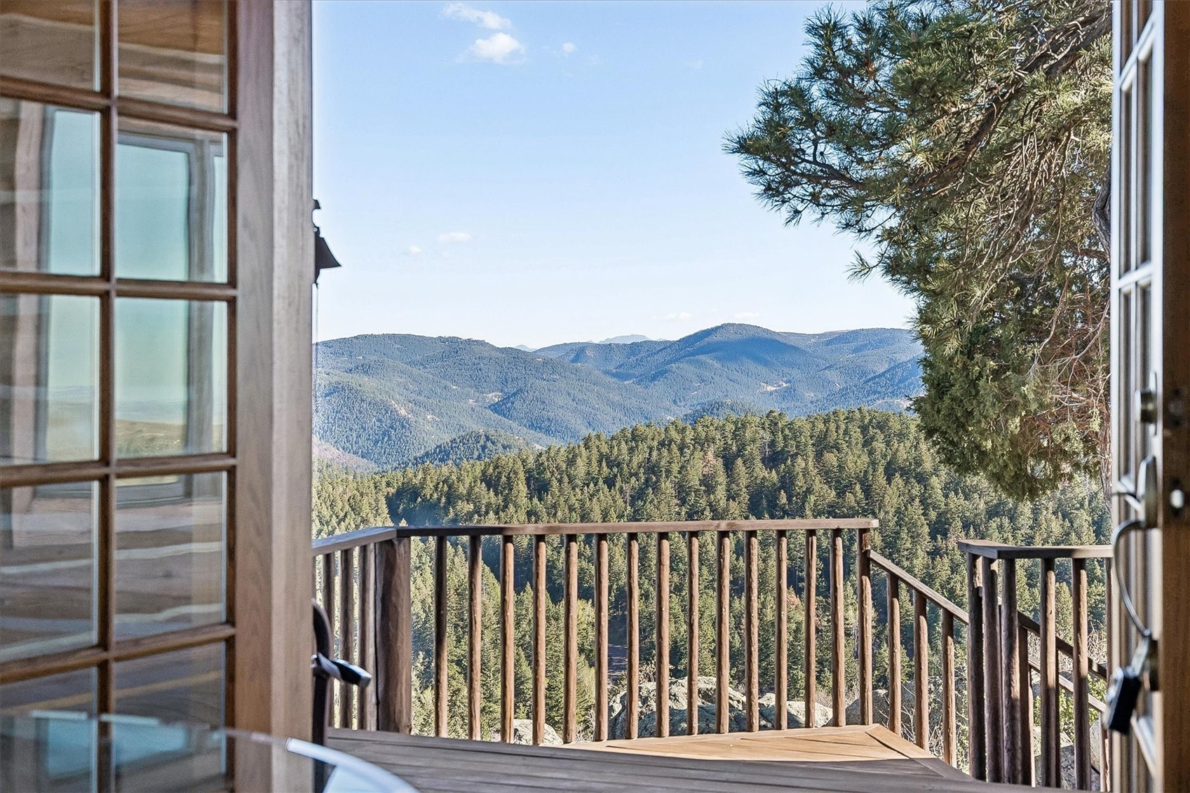 51 West Ranch Trail Morrison, CO 80465 - Photo 25 of 50 a view of a balcony with a swing