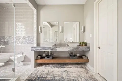 a utility room with cabinets washer and dryer