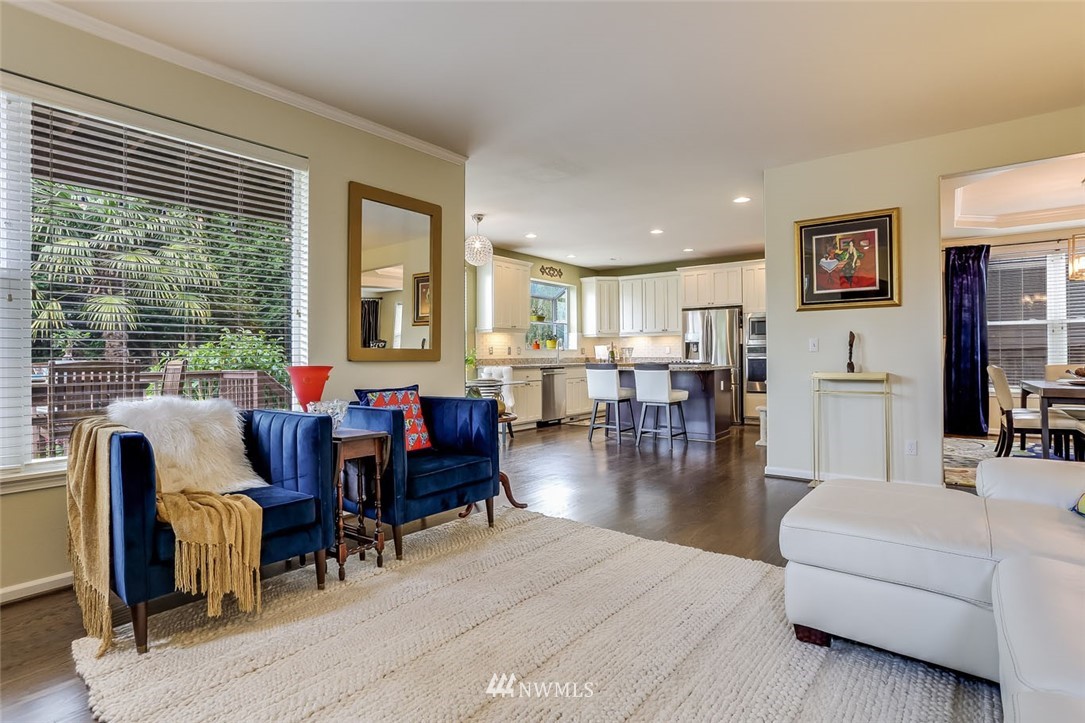 906 North 33rd Street Renton, WA 98056 - Photo 12 of 40 a living room with furniture dining table and a large window