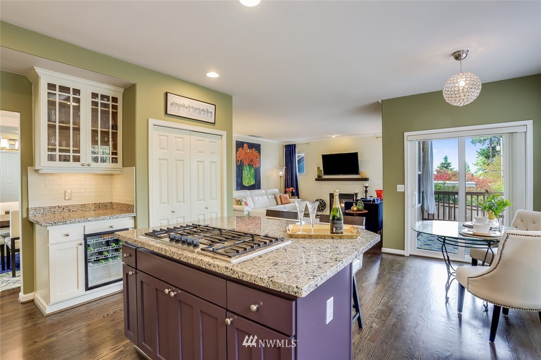 906 North 33rd Street Renton, WA 98056 - Photo 17 of 40 a kitchen with a stove and a wooden floor