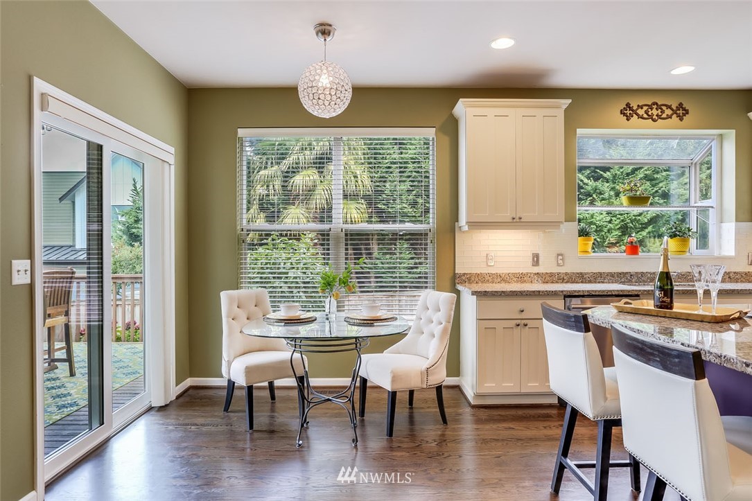 906 North 33rd Street Renton, WA 98056 - Photo 18 of 40 a dining room with furniture a chandelier and wooden floor