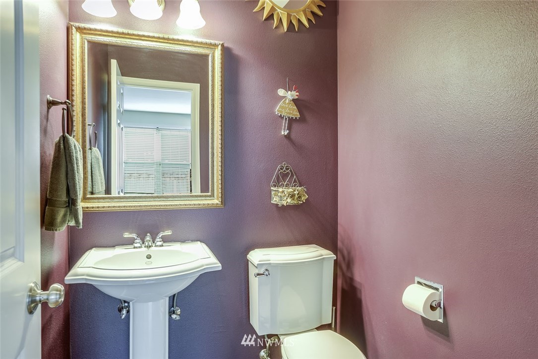 906 North 33rd Street Renton, WA 98056 - Photo 19 of 40 a bathroom with a toilet sink and mirror
