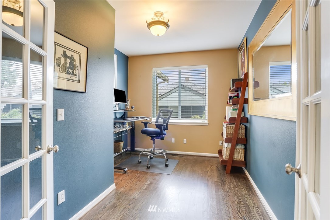 906 North 33rd Street Renton, WA 98056 - Photo 20 of 40 a view of a workspace with furniture and a window