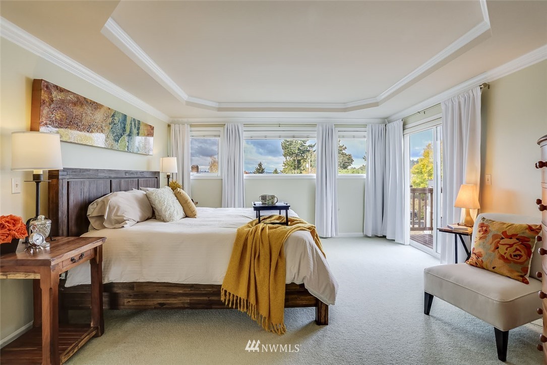 906 North 33rd Street Renton, WA 98056 - Photo 23 of 40 a bedroom with a bed and a couch