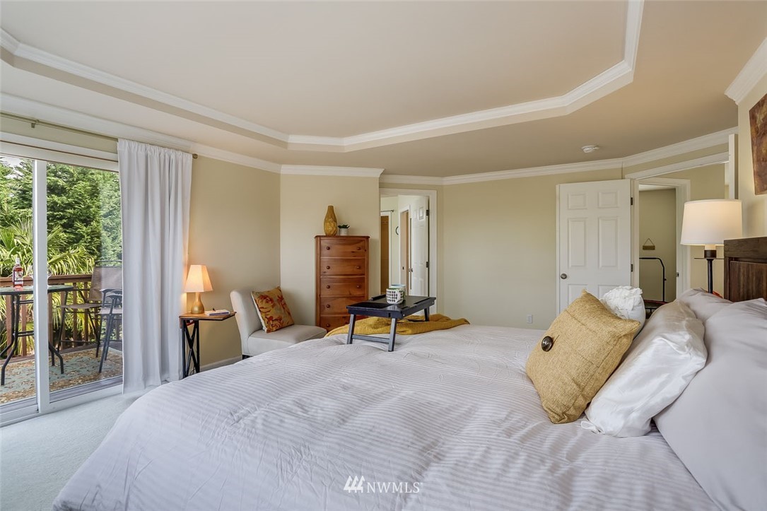 906 North 33rd Street Renton, WA 98056 - Photo 24 of 40 a bedroom with a bed and a table chair