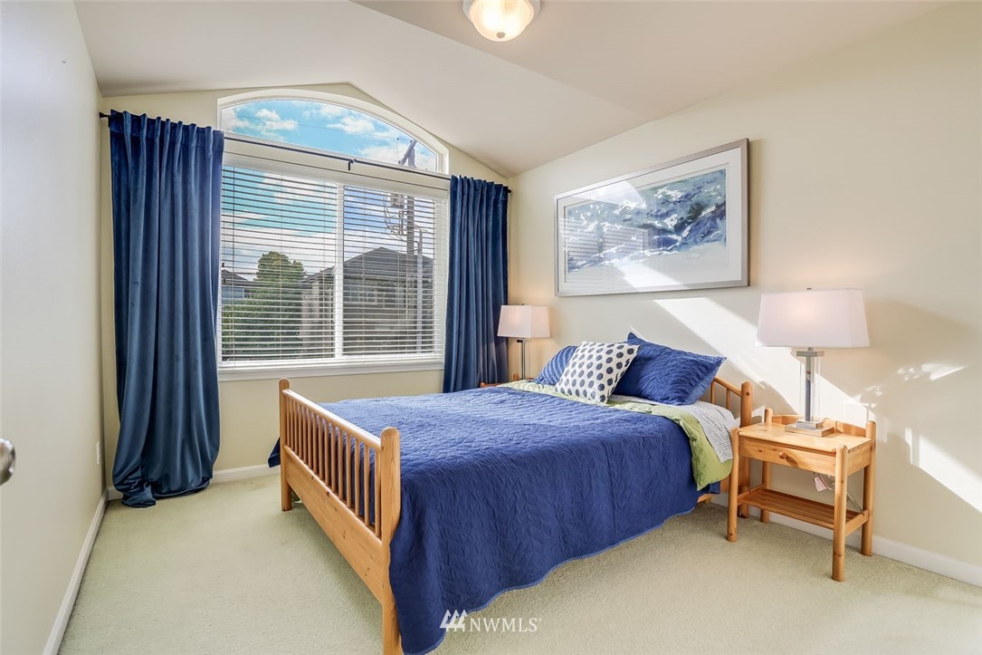 906 North 33rd Street Renton, WA 98056 - Photo 29 of 40 a bedroom with a bed and a large window