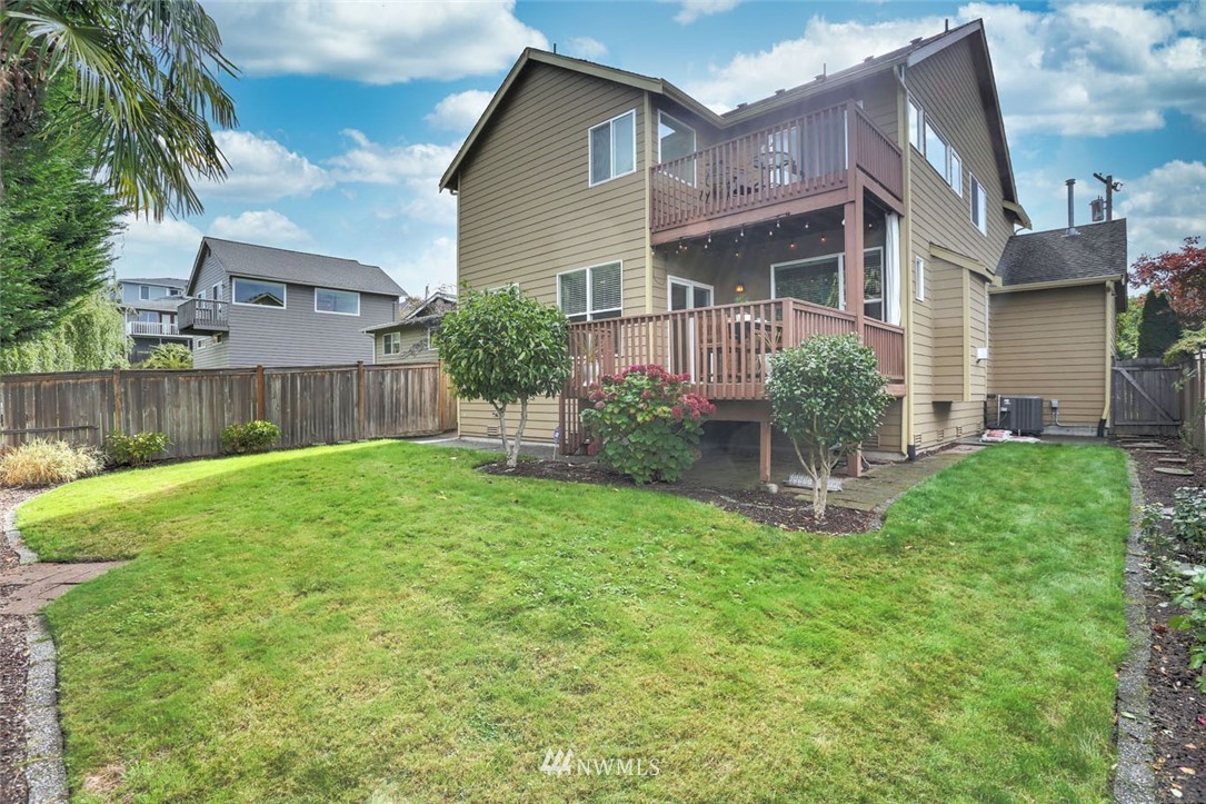 906 North 33rd Street Renton, WA 98056 - Photo 36 of 40 a view of a house with a yard and a garden
