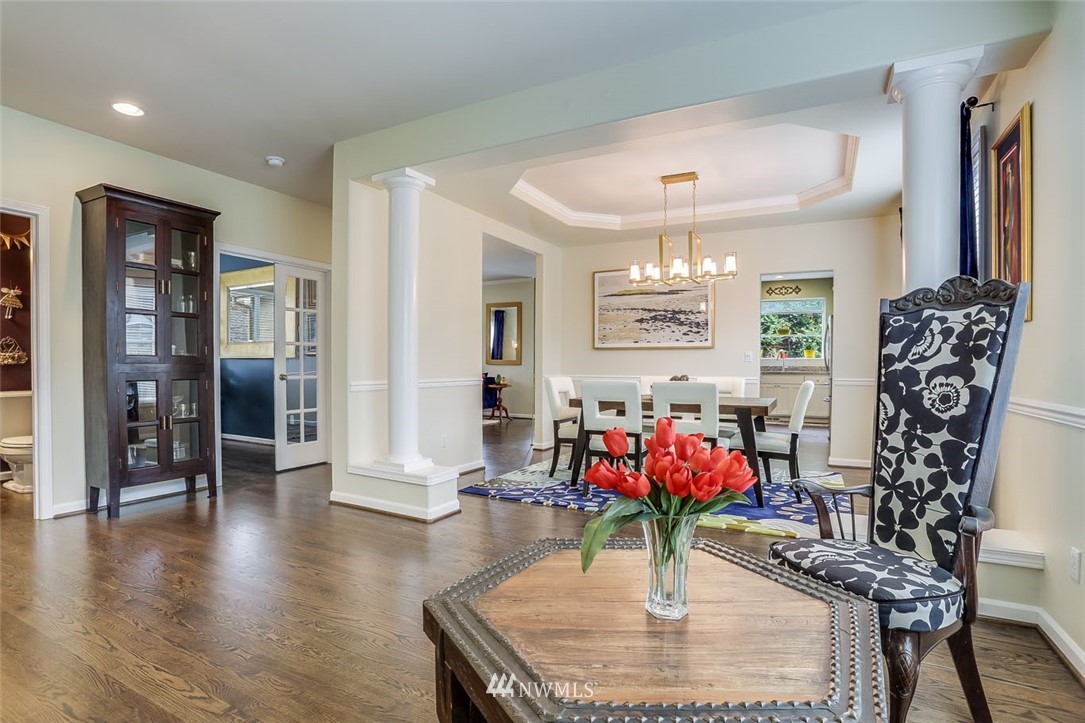 906 North 33rd Street Renton, WA 98056 - Photo 9 of 40 an entryway with a chandelier and wooden floor