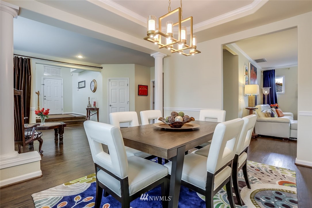 906 North 33rd Street Renton, WA 98056 - Photo 10 of 40 a view of a dining room with furniture and wooden floor