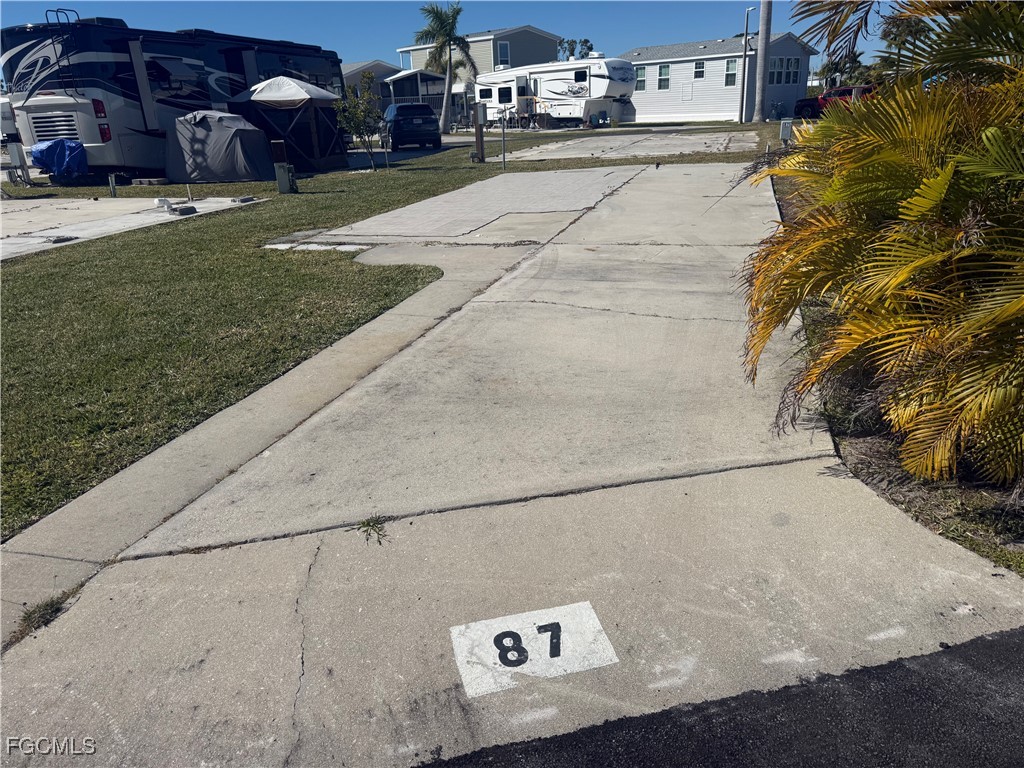 19681 Summerlin Road, Unit 87 Fort Myers, FL 33908 - Photo 1 of 15 a view of a street with cars on road
