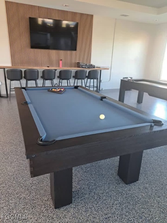19681 Summerlin Road, Unit 87 Fort Myers, FL 33908 - Photo 6 of 15 a living room with furniture and a flat screen tv