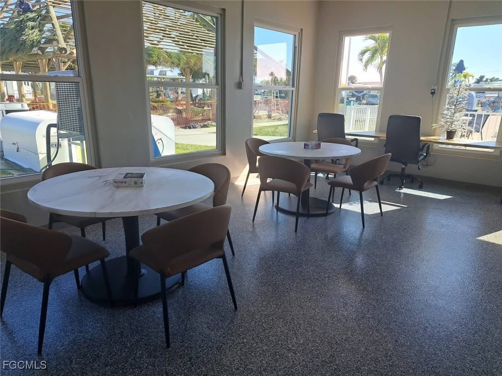 19681 Summerlin Road, Unit 87 Fort Myers, FL 33908 - Photo 8 of 15 a view of a dining room with furniture window and outside view