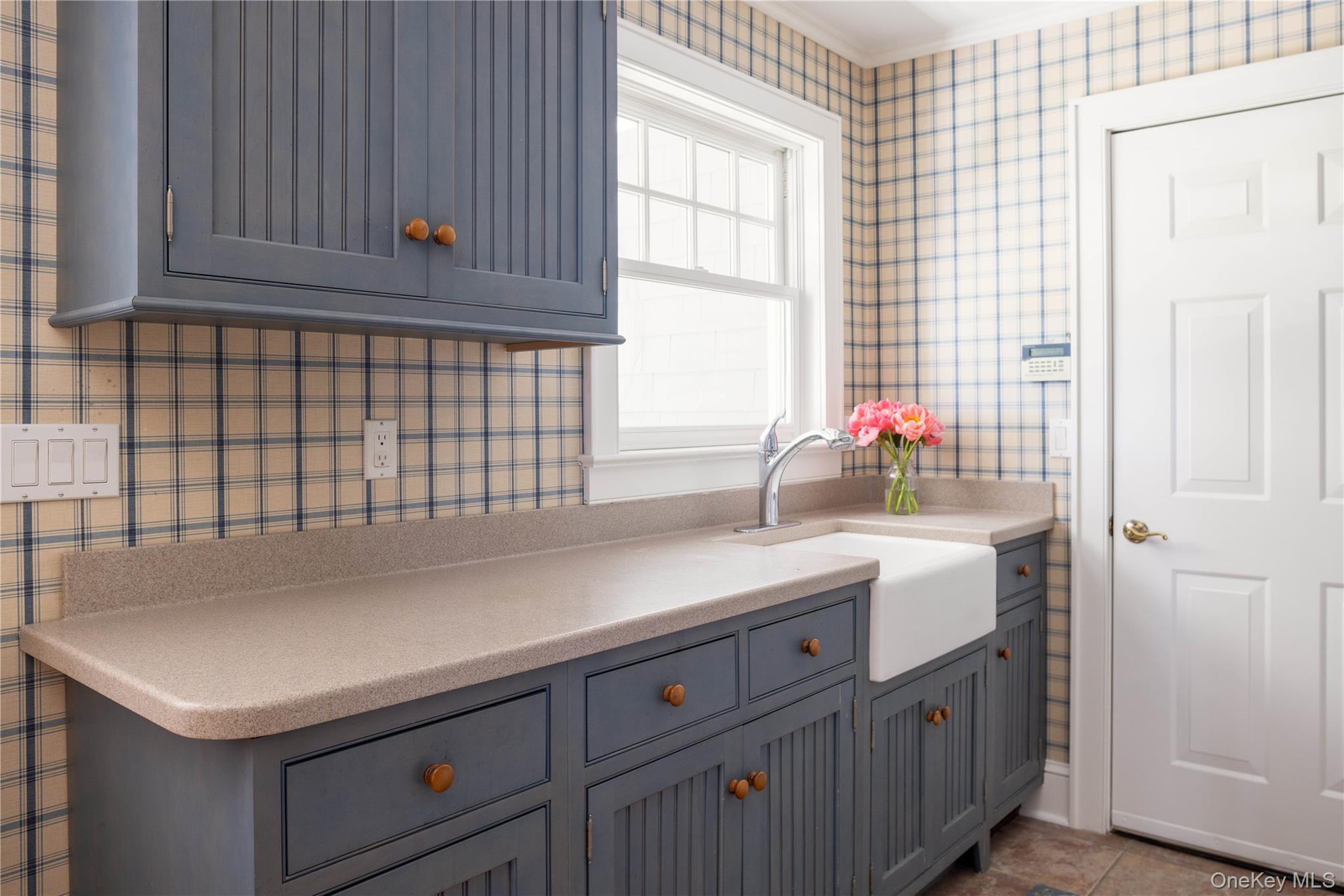 5055 New Suffolk Road New Suffolk, NY 11956 - Photo 30 of 42 a kitchen with a sink and cabinets