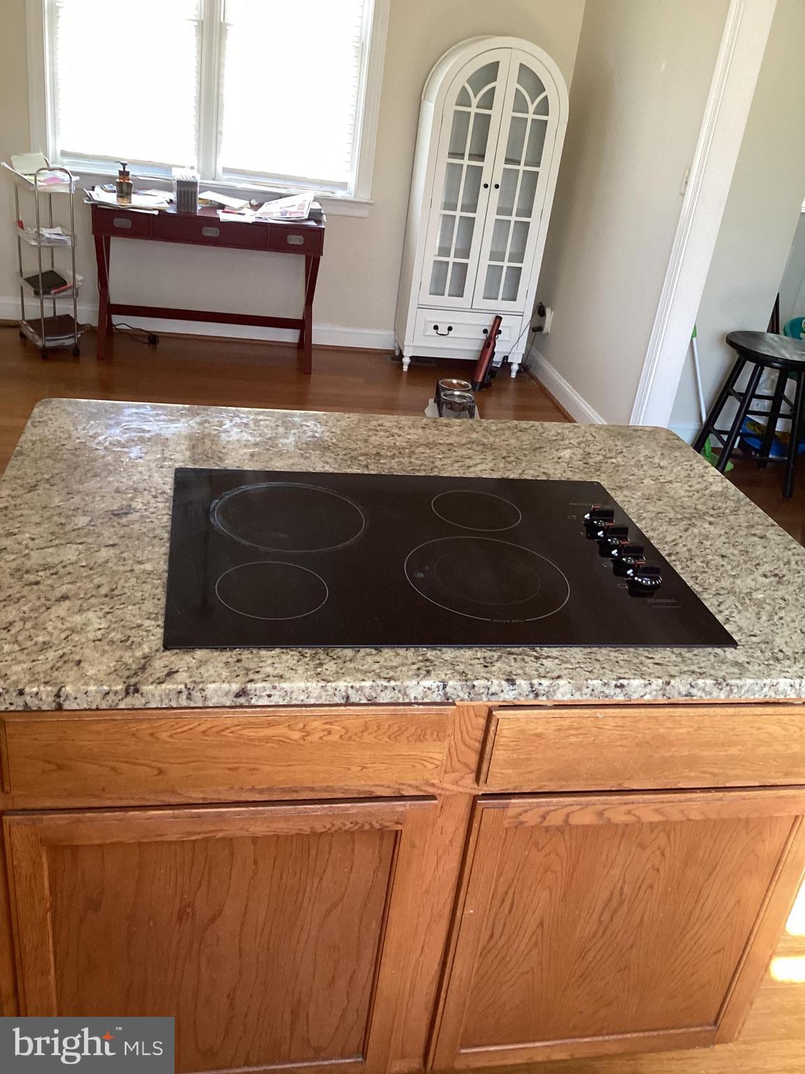 7612 Marye Road Spotsylvania, VA 22551 - Photo 3 of 39 a living room with granite countertop furniture and a fireplace
