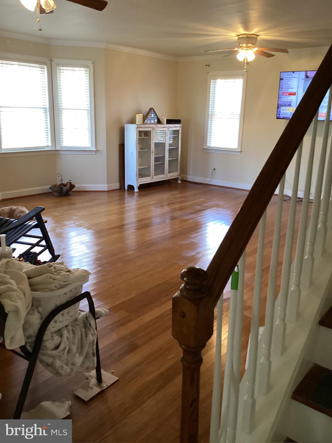 7612 Marye Road Spotsylvania, VA 22551 - Photo 33 of 39 a living room with furniture and a wooden floor