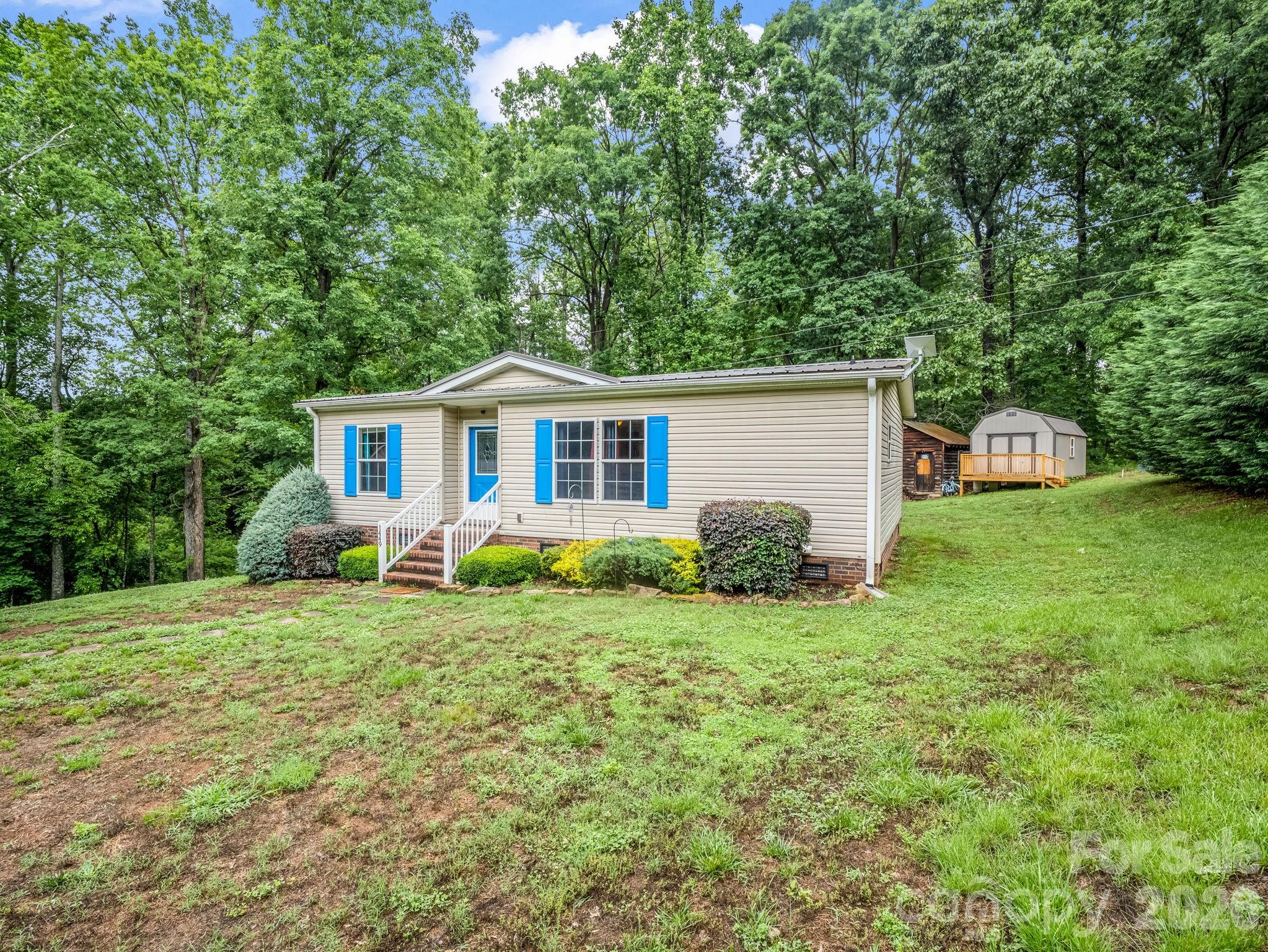 1449 Toney Road Bostic, NC 28018 - Photo 2 of 43 a view of a house with backyard and garden