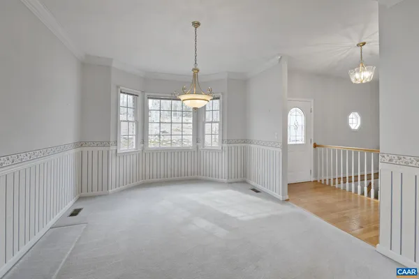 a kitchen with stainless steel appliances granite countertop a sink a stove a refrigerator and cabinets