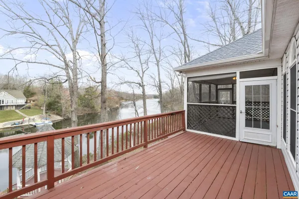 a white house that has a tree in front of it