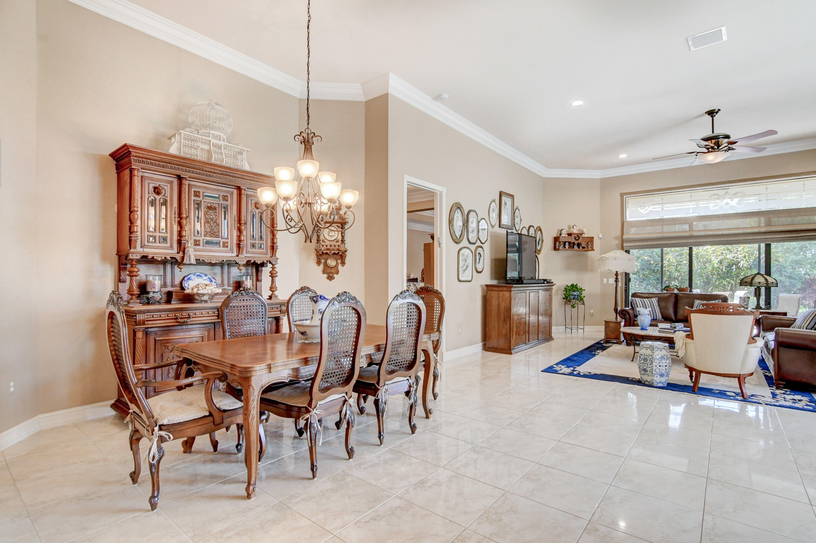 6863 Boscanni Drive Boynton Beach, FL 33437 - Photo 12 of 61 a view of a dining room with furniture and floor to ceiling window