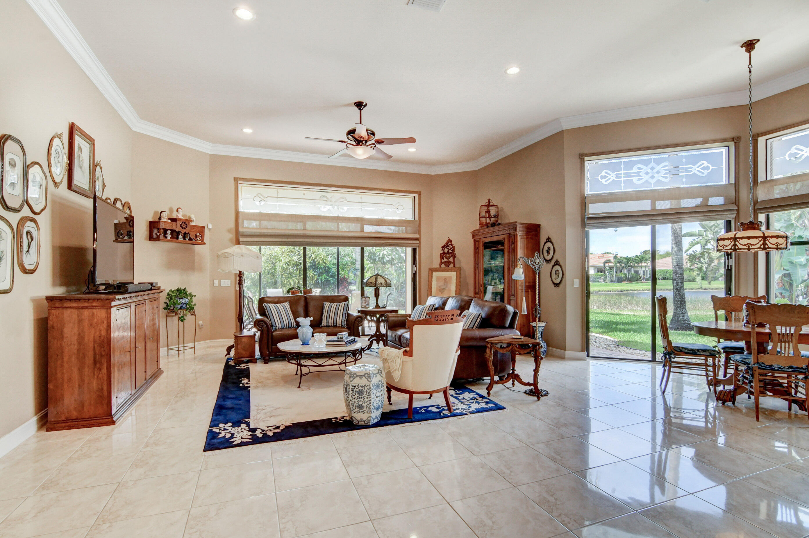 6863 Boscanni Drive Boynton Beach, FL 33437 - Photo 14 of 61 a living room with furniture large window and flat screen tv