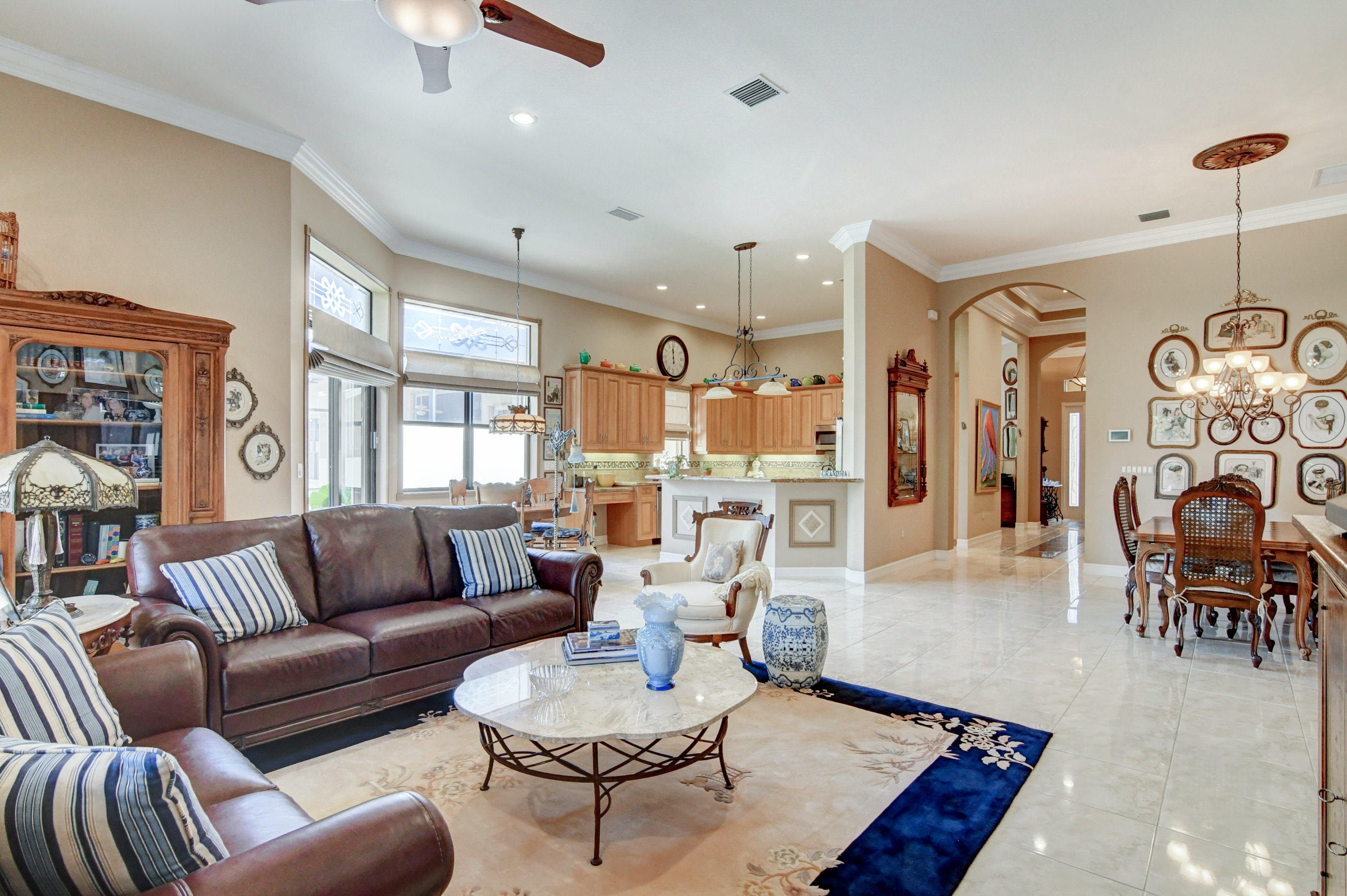 6863 Boscanni Drive Boynton Beach, FL 33437 - Photo 15 of 61 a living room with furniture kitchen view and a wooden floor