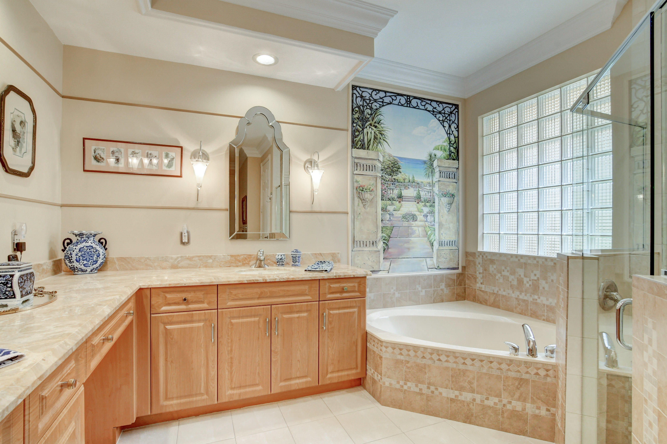 6863 Boscanni Drive Boynton Beach, FL 33437 - Photo 27 of 61 a spacious bathroom with a granite countertop sink a toilet a mirror and shower