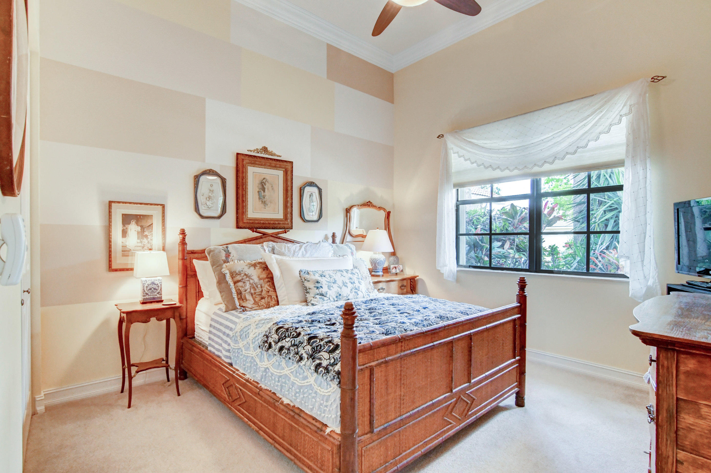 6863 Boscanni Drive Boynton Beach, FL 33437 - Photo 30 of 61 a bed sitting in a bedroom next to a window