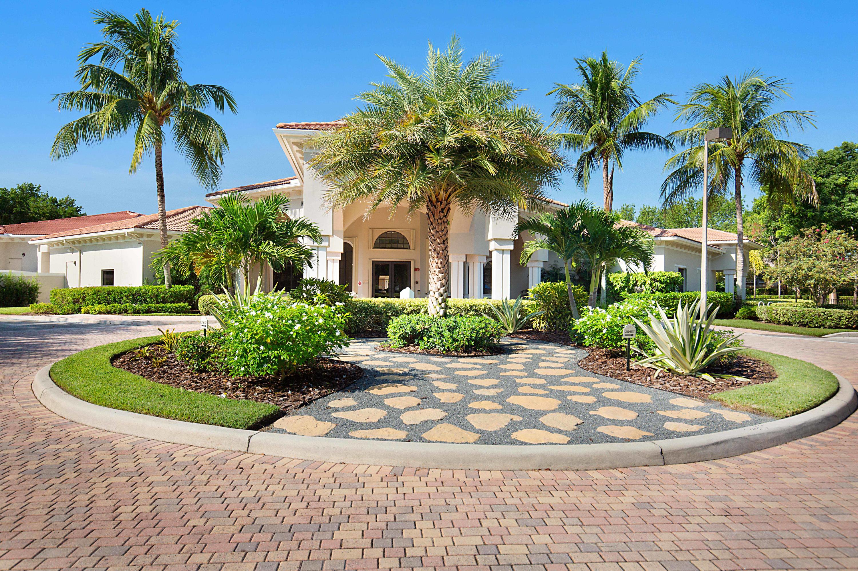 6863 Boscanni Drive Boynton Beach, FL 33437 - Photo 43 of 61 a view of a house with a yard and palm trees