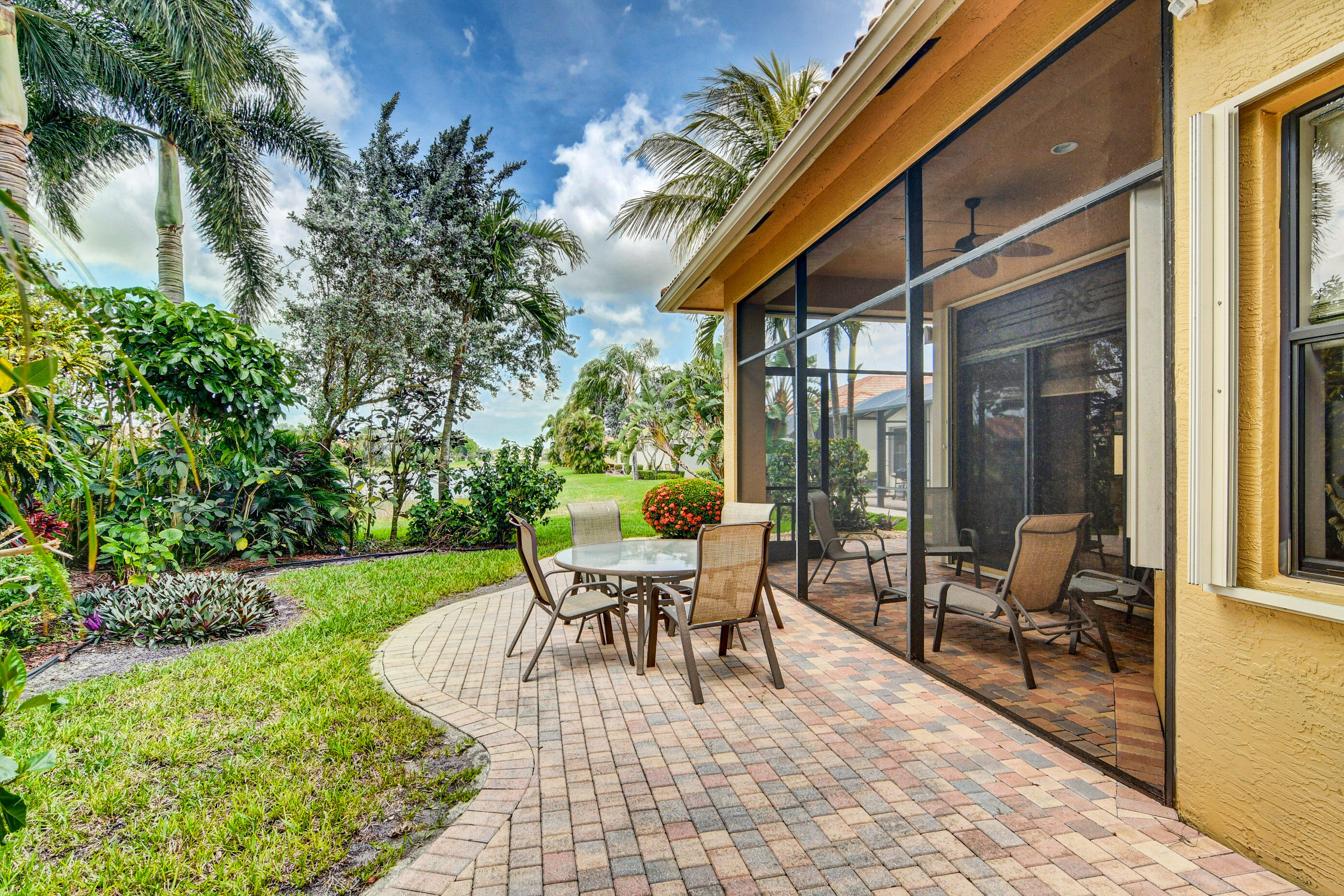 6863 Boscanni Drive Boynton Beach, FL 33437 - Photo 8 of 61 a balcony with furniture and a garden