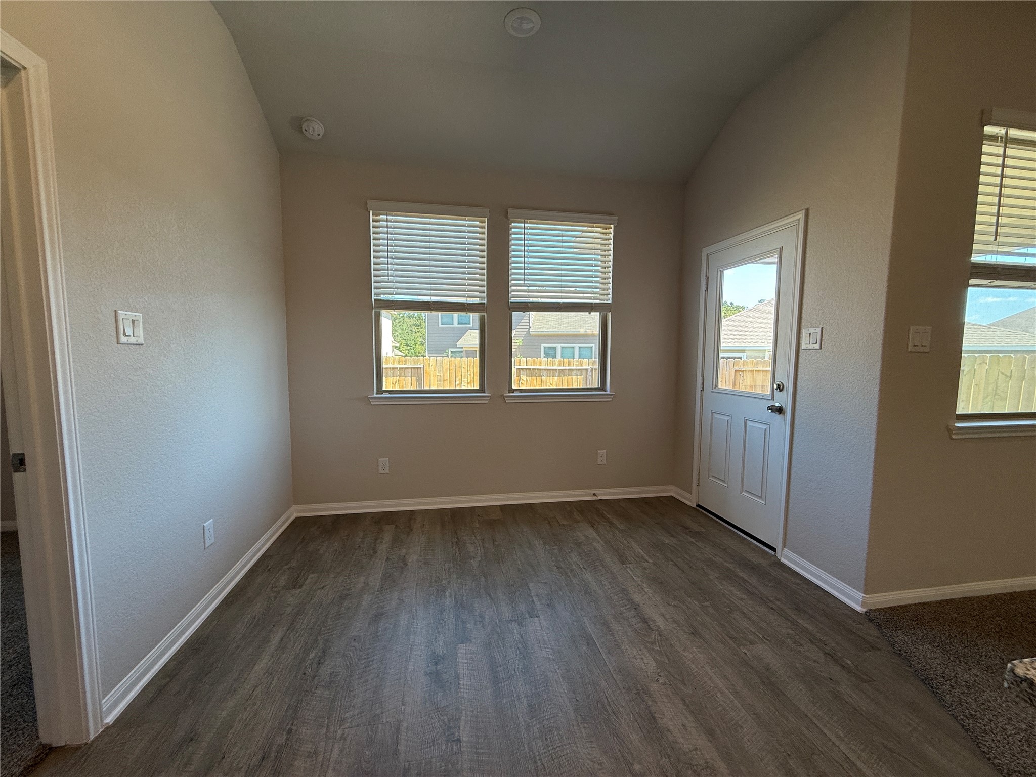 2220 Cedar Valley Drive Conroe, TX 77306 - Photo 13 of 22 an empty room with wooden floor and windows