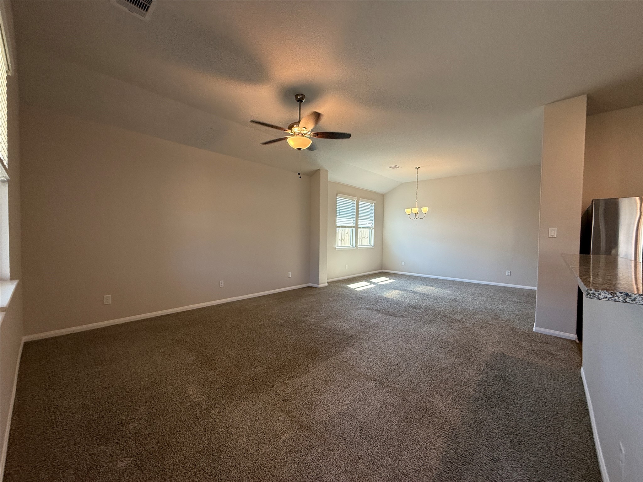 2220 Cedar Valley Drive Conroe, TX 77306 - Photo 22 of 22 a view of a livingroom with a ceiling fan and window