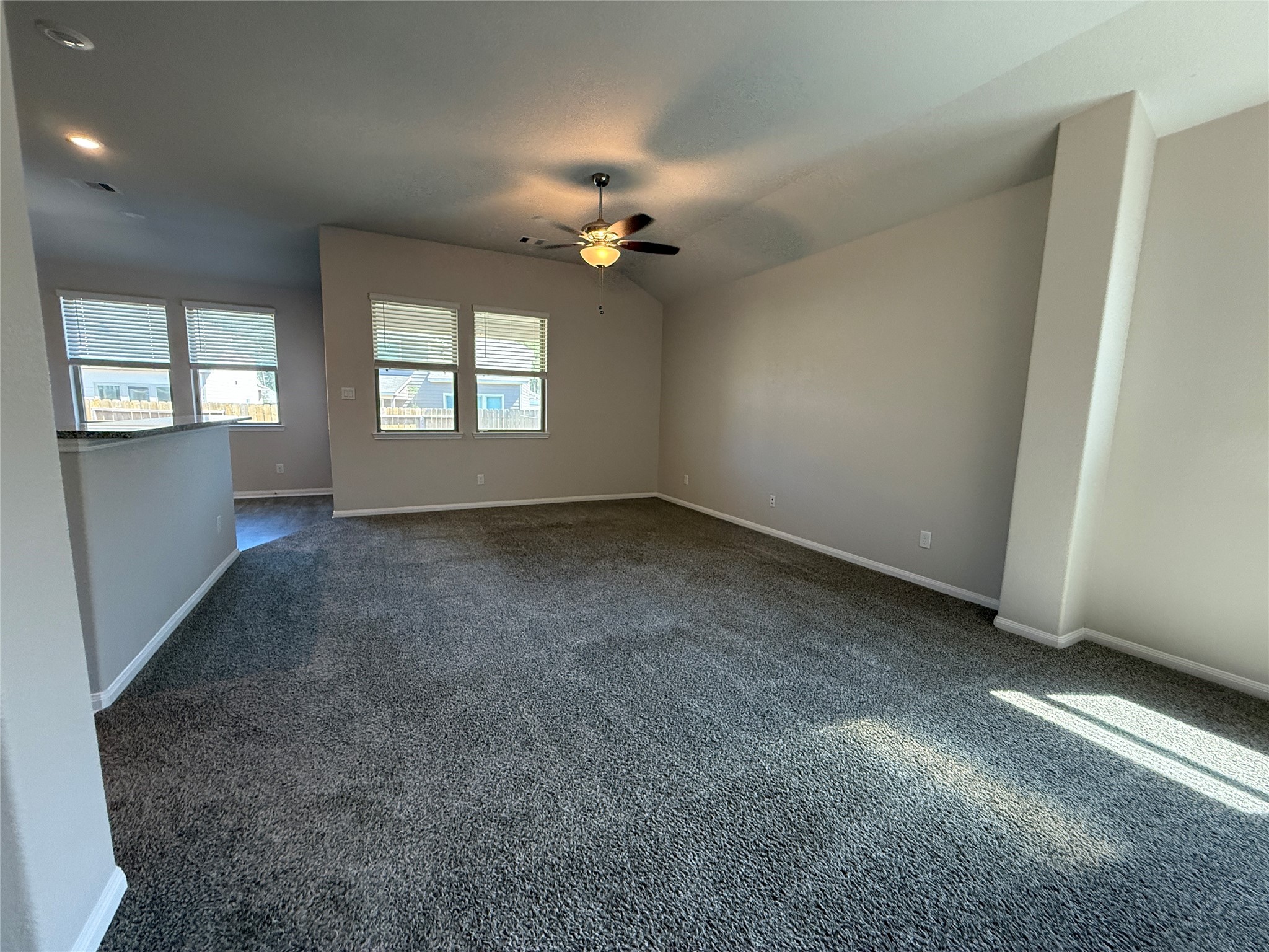 2220 Cedar Valley Drive Conroe, TX 77306 - Photo 9 of 22 an empty room with windows and fan
