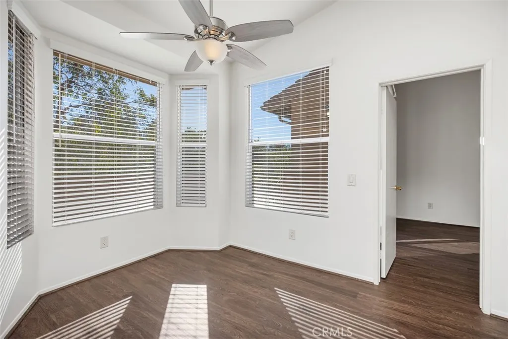 19431 Rue De Valore Lake Forest, CA 92610 - Photo 12 of 30 a view of an empty room with wooden floor and a window